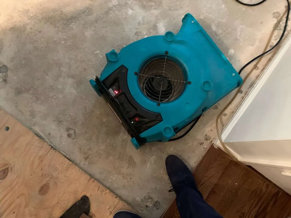 Air mover drying subfloor during Leak Detection & Repair in Monterey